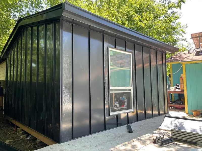 Black standing seam metal wall panels for Roof Inspection in Crystal City